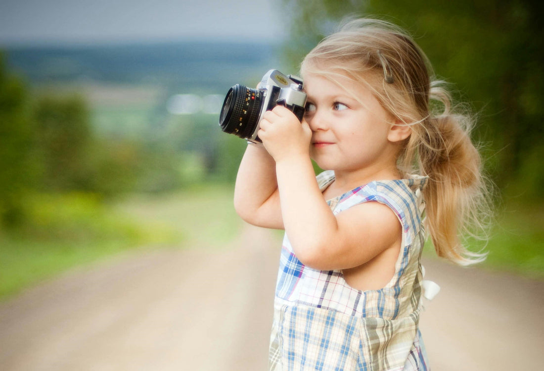 girl taking photos with camera